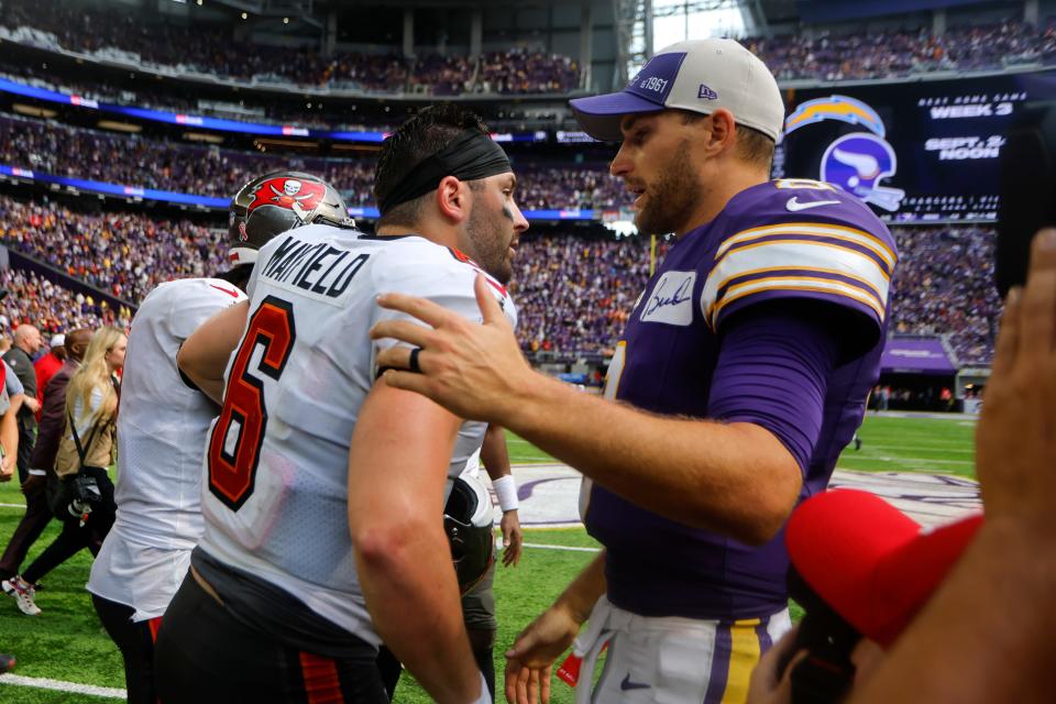 Tampa Bay Buccaneers quarterback Baker Mayfield (6) talks with Minnesota Vikings quarterback Kirk Cousins (8) after an NFL football game, Sunday, Sept. 10, 2023, in Minneapolis.