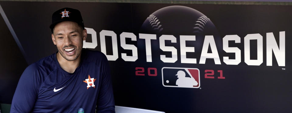 Houston Astros shortstop Carlos Correa smiles as he talks with reporters during a baseball practice Wednesday, Oct. 6, 2021, in Houston. The Astros will host the Chicago White Sox in an American League Division Series game Thursday. (AP Photo/David J. Phillip)