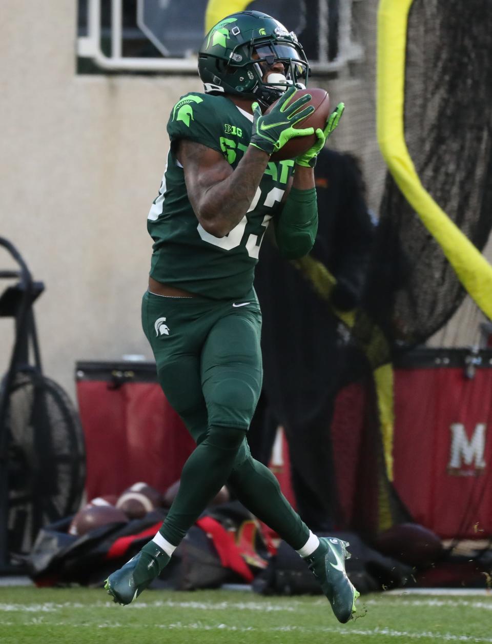 Michigan State Spartans wide receiver Montorie Foster (83) makes a touchdown catch against Maryland Terrapins defensive back Lavonte Gater (37) during first half action Saturday, Nov. 13, 2021 at Spartan Stadium.