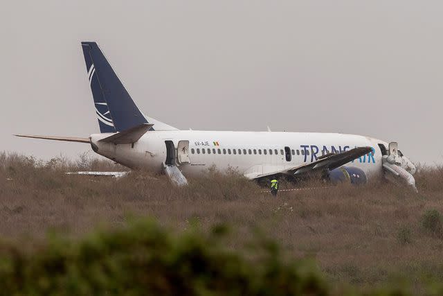 <p>JEROME FAVRE/EPA-EFE/Shutterstock </p> TransAir flight after it skidded off the runway on May 9