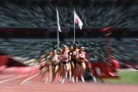 <p>Athletes compete in the women's 3000m steeplechase heats during the Tokyo 2020 Olympic Games at the Olympic Stadium in Tokyo on August 1, 2021. (Photo by Jewel SAMAD / AFP)</p> 