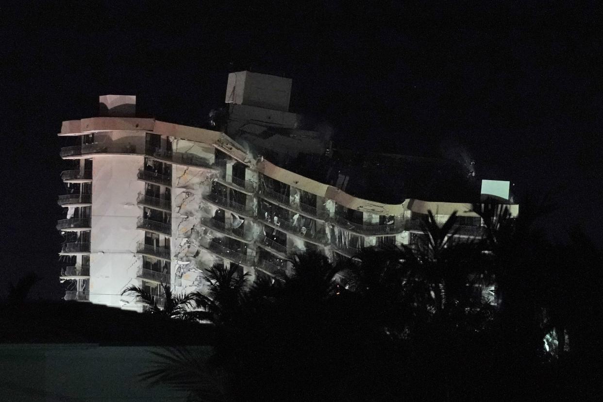 Demolition teams bring down the unstable remainder of the Champlain Towers South condo building, late Sunday, July 4, 2021, in Surfside, Fla.