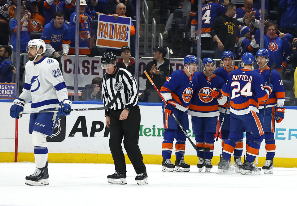 Tampa Bay Lightning left wing Nicholas Paul (20) goes to the bench after a goal by the New York Islanders, right, during the first period of an NHL hockey game, Thursday, Feb. 8, 2024, in New York. (AP Photo/Noah K. Murray)