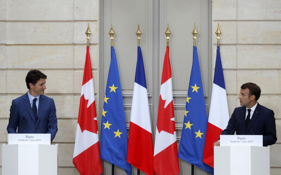 French President Emmanuel Macron, right, Canadian Prime Minister Justin Trudeau attend a joint press conference at the Elysee Palace in Paris, France, Friday, June 7, 2019. (Philippe Wojazer/Pool via AP)