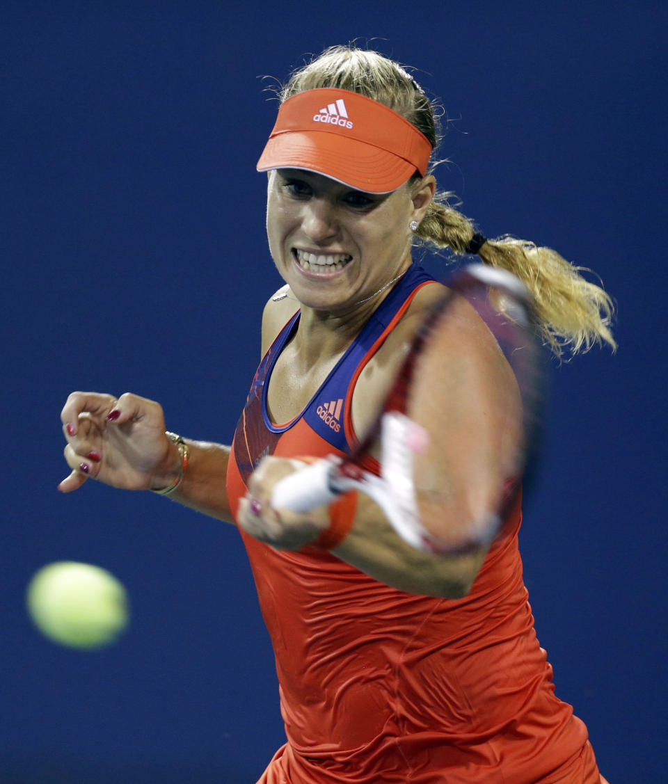 Angelique Kerber, of Germany, returns a shot to Czech Republic's Lucie Hradecka during the opening round of the U.S. Open tennis tournament Monday, Aug. 26, 2013, in New York. (AP Photo/Darron Cummings)