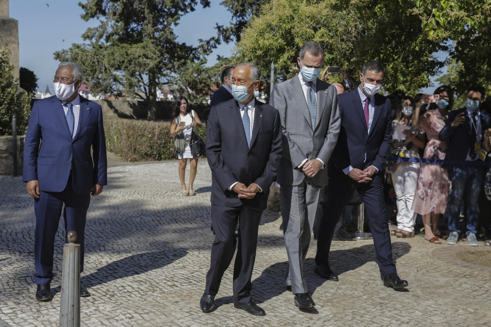 From left to right: Portugal's Prime Minister Antonio Costa, Portugal's President Marcelo Rebelo de Sousa, Spain's King Felipe VI, and Spain's Prime Minister Pedro Sanchez during a ceremony to mark the reopening of the Portugal/Spain border in Badajoz, Spain, Wednesday, July 1, 2020. The border was closed for three and a half months due to the coronavirus pandemic. (AP Photo/Armando Franca)
