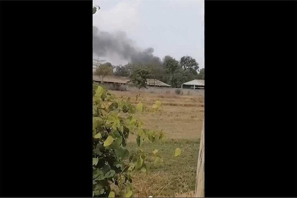 FILE - In this image from a video, smoke rises above a distant base, seen from Chbar Mon district in Kompong Speu province, Cambodia on April 27, 2024. A huge explosion in southwestern Cambodia over the weekend that killed 20 soldiers at an army base appears to have been an accident caused by mishandling of ammunition by troops, a senior military official said Tuesday, April 30. (Chim Sothea via AP, File)