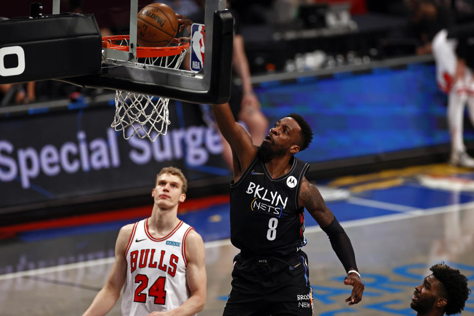 Brooklyn Nets forward Jeff Green (8) dunks the ball over Chicago Bulls forward Lauri Markkanen during the second half of an NBA basketball game Saturday, May 15, 2021, in New York. (AP Photo/Adam Hunger)