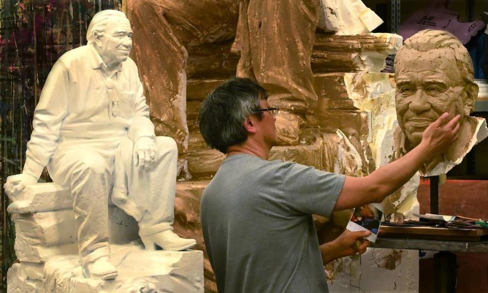 Working in the stage room of the Minnaert Center for the Arts at South Puget Sound Community College on June 7, 2024 Seattle artist Haiying Wu continues his sculpting of the Billy Frank Jr. statue destined for the National Statuary Hall.