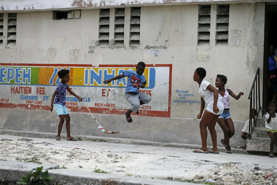 In this May 25, 2019 photo, children jump rope in the neighborhood of Lower Delmas, a district of Port-au-Prince, Haiti. The neighborhood has tens of thousands of poor and working-class people in the Haitian capital. (AP Photo/Dieu Nalio Chery)