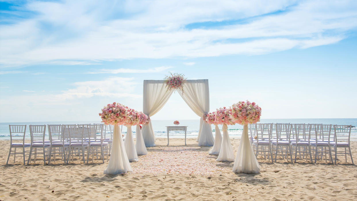  A wedding ceremony on the beach. 