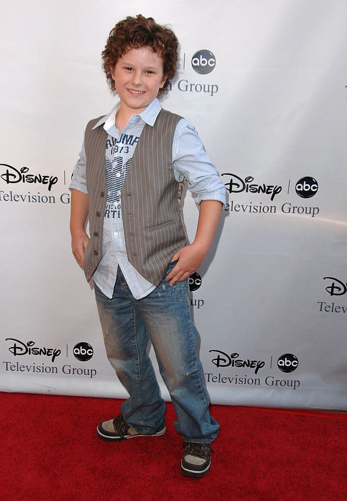 A young Nolan smiles on the red carpet