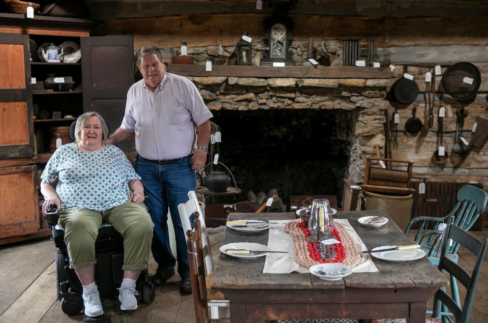 Lloyd and Diann Helber, of Lancaster, stand inside of the renovated Pioneer Log House at the Fairfield County Fairgrounds on September 25, 2023, in Lancaster, Ohio. The Helbers donated money to the through the Fairfield County Foundation to restore the log house.