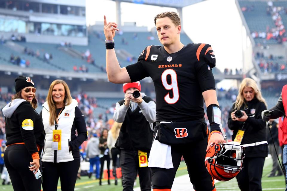 Cincinnati Bengals quarterback Joe Burrow (9) celebrates a 41-21 win over the Baltimore Ravens after an NFL football game, Sunday, Dec. 26, 2021, in Cincinnati.