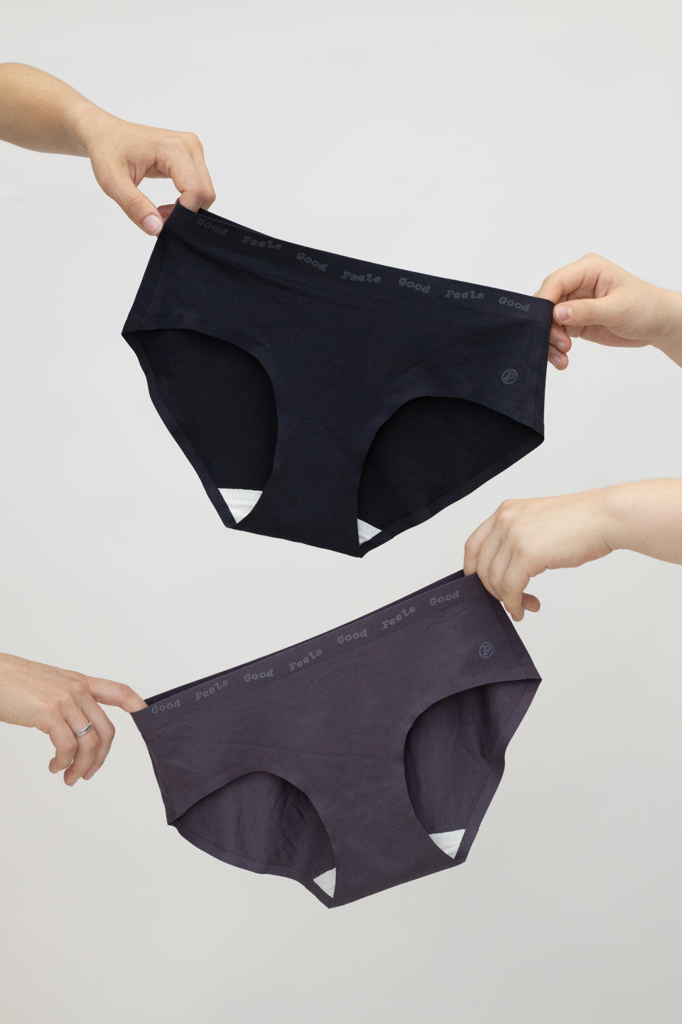 Hands holding Paire undies