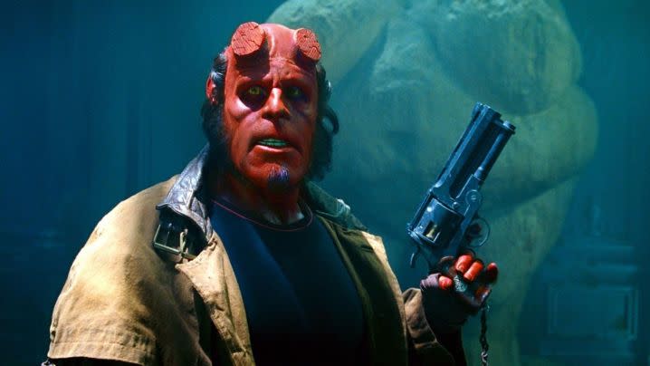 Ron Perlman cocks his gun in Hellboy (2004), directed by Guillermo del Toro.