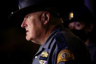 Washington State Patrol Capt. Ron Mead briefs media near the scene where two people in a group of protesters were struck by a car on Interstate 5, in Seattle