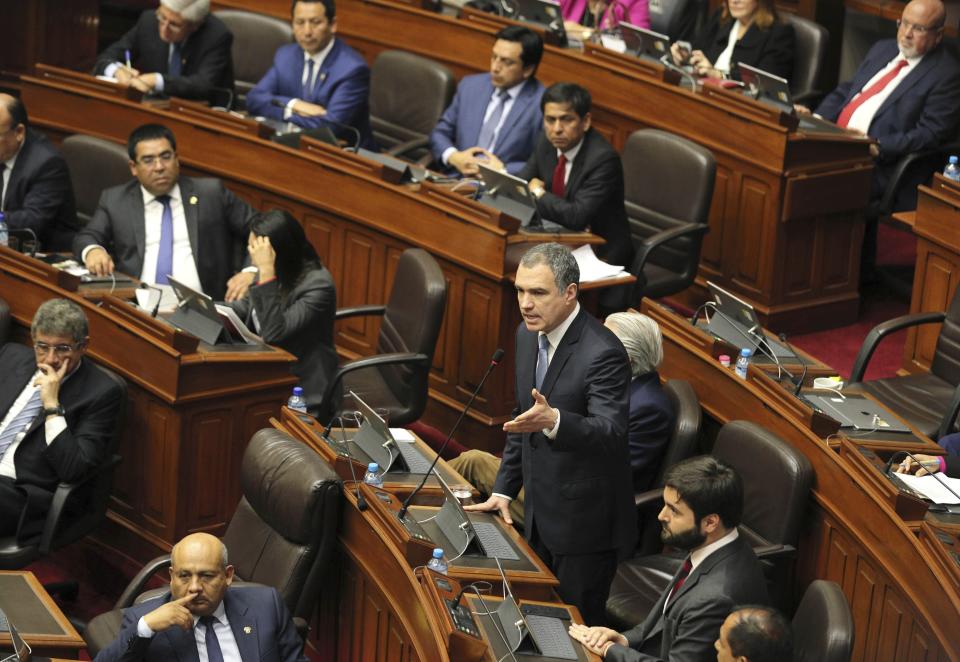 Peruvian Prime Minister Salvador del Solar, center, asks for a vote of confidence for his administration during a legislative session, in Lima, Peru, Monday, Sept. 30, 2019. The political duel between Peruvian President Martin Vizcarra and Congress intensified in recent weeks after lawmakers decided to shelve Vizcarra's proposal to hold early presidential and congressional elections, which he argues is necessary to break the deadlock and stabilize the nation. (AP Photo/Martin Mejia)