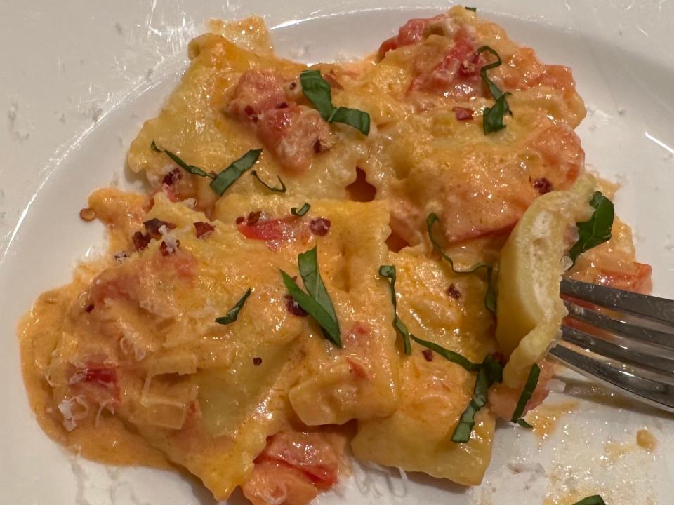 seafood ravioli on plate with fork