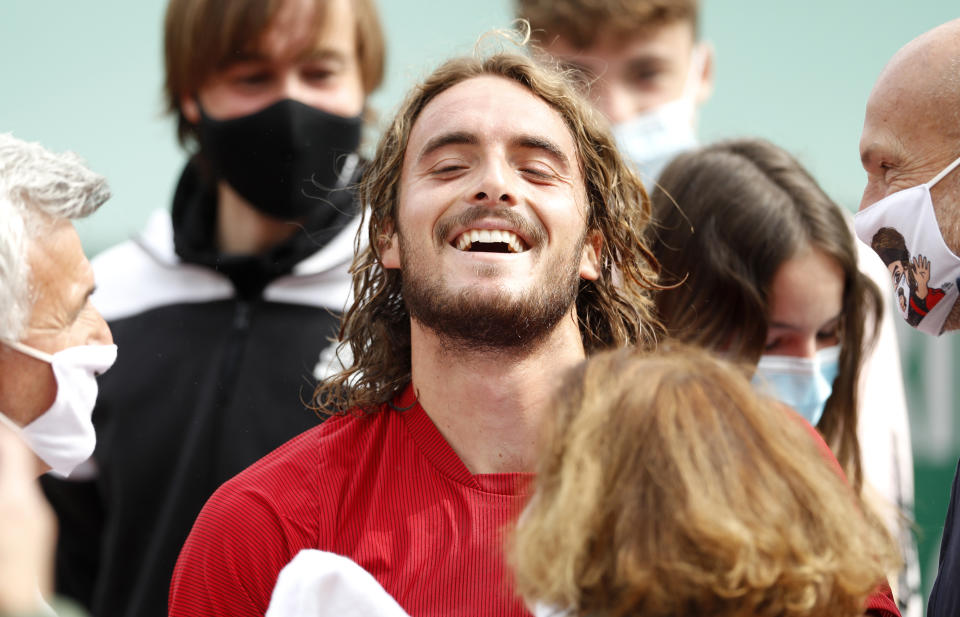 Stefanos Tsitsipas of Greece celebrates after defeating Andrey Rublev of Russia during the Monte Carlo Tennis Masters tournament finals in Monaco, Sunday, April 18, 2021. (AP Photo/Jean-Francois Badias)