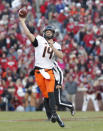 Oklahoma State quarterback Taylor Cornelius (14) throws against Oklahoma in the second half of an NCAA college football game in Norman, Okla., Saturday, Nov. 10, 2018. Oklahoma won 48-47. (AP Photo/Alonzo Adams)