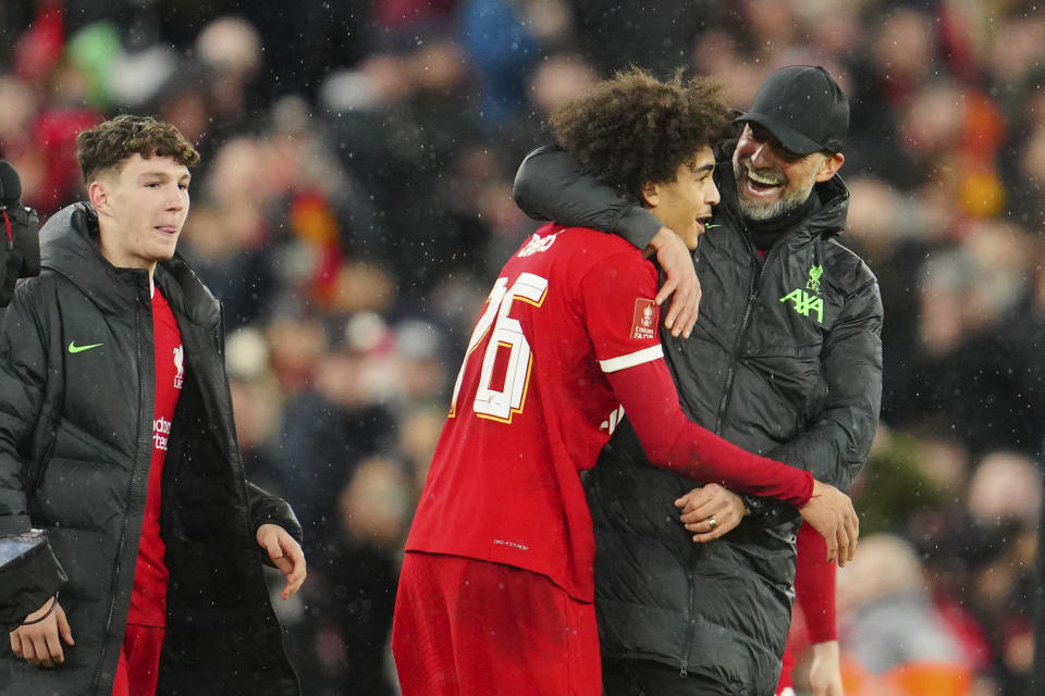 Liverpool's manager Jurgen Klopp congratulates his player Jayden Danns at the end of the English FA Cup fifth round soccer match between Liverpool and Southampton at Anfield stadium, in Liverpool, Wednesday, Feb. 28, 2024. (AP Photo/Jon Super)