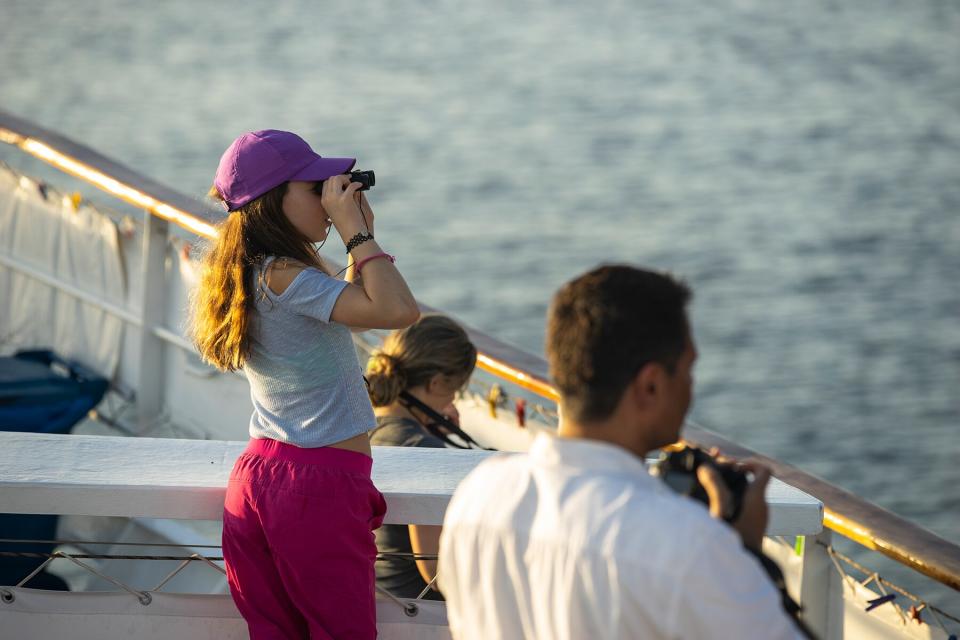 A family sight seeing the Galapagos from on board the Quasar Expeditions, Evolution ship