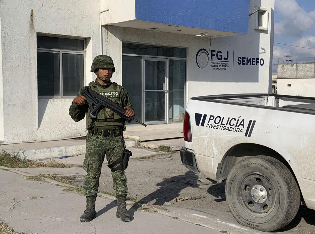 A Mexican army soldier guards the Tamaulipas State Prosecutor´s headquarters in Matamoros, Mexico, Wednesday, March 8, 2023. A road trip to Mexico for cosmetic surgery veered violently off course when four Americans were caught in a drug cartel shootout, leaving two dead and two held captive for days in a remote region of the Gulf coast before they were rescued from a wood shack, officials said Tuesday. (AP Photo)