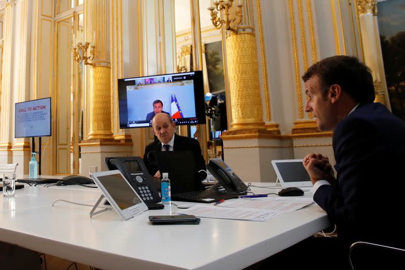 French President Emmanuel Macron speaks with Tedros Adhanom Ghebreyesus, Director General of the World Health Organization and other world leaders about the coronavirus outbreak during a video conference at the Elysee Palace in Paris