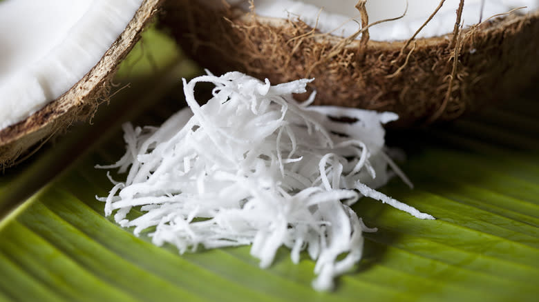 shredded coconut flakes with coconut shell halves