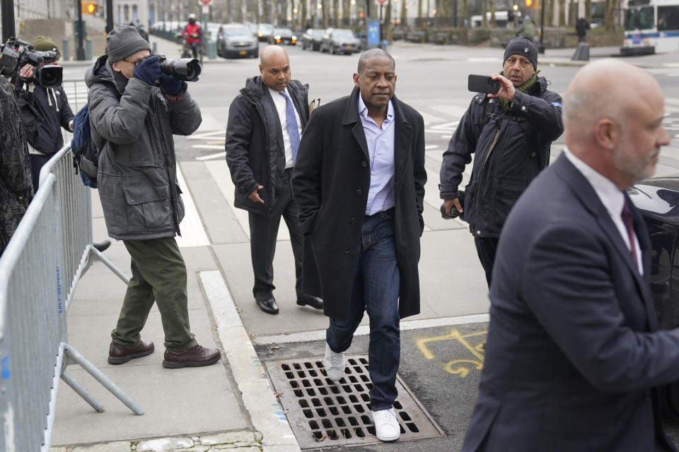 Carlos Watson, center, leaves Brooklyn federal court in New York, Thursday, Feb. 23, 2023. The founder of the troubled digital start-up Ozy Media has been arrested on fraud charges as part of what prosecutors say was a scheme to prop up the financially struggling company. (AP Photo/Seth Wenig)