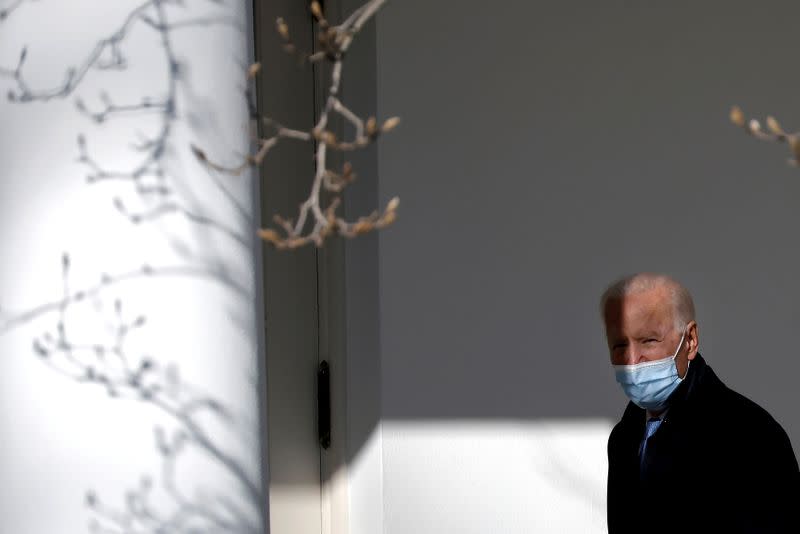 FILE PHOTO: U.S. President Biden walks into Oval Office in Washington