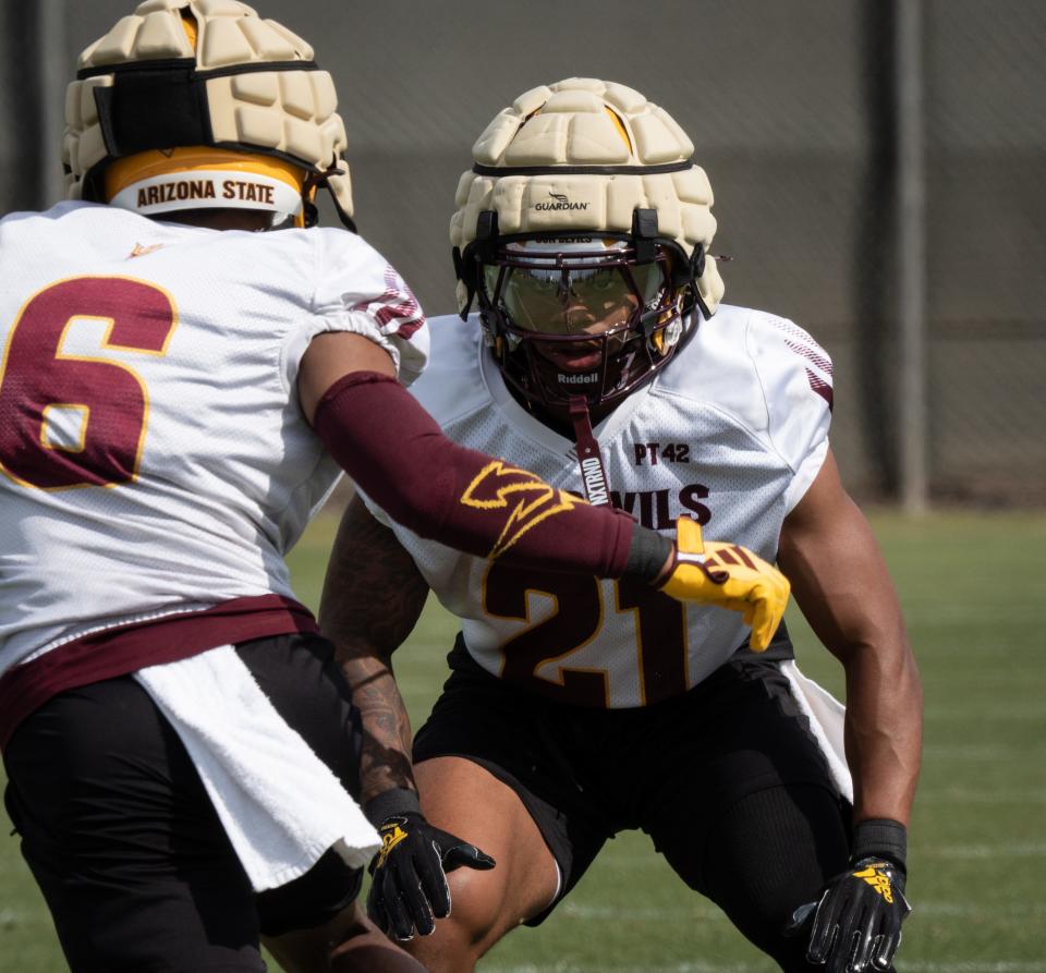 ASU football defensive back Cole Martin (right) runs a drill during practice on March 26, 2024, at ASU's Kajikawa Practice fields in Tempe.