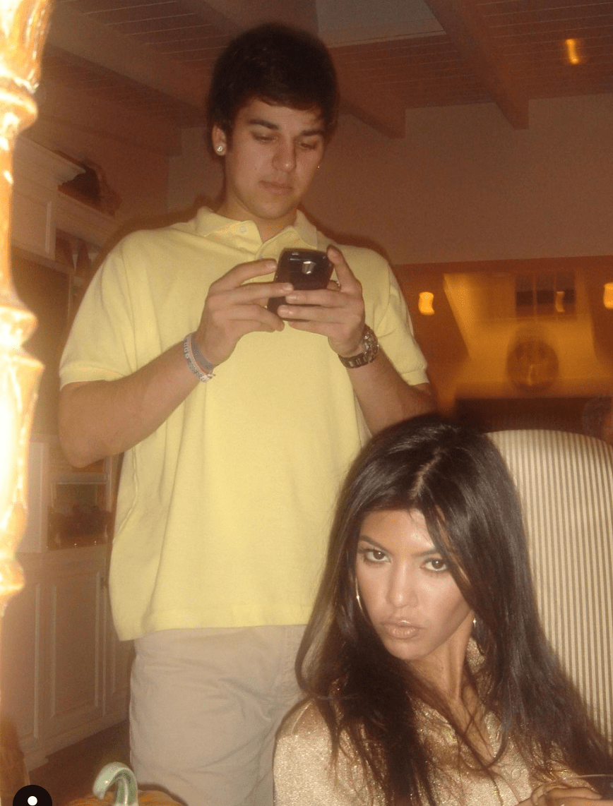 Kourtney shared a throwback photo showing her brother Rob as a teen while the two were addicted to their Blackberry devices.