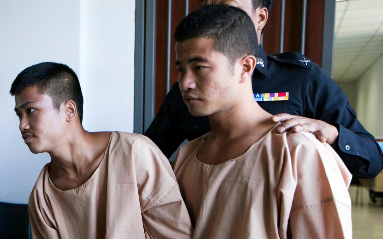 Myanmar migrants Win Zaw Htun, right, and Zaw Lin, left, both 22, after the guilty verdict in 2015 in Koh Samui, Thailand - AP