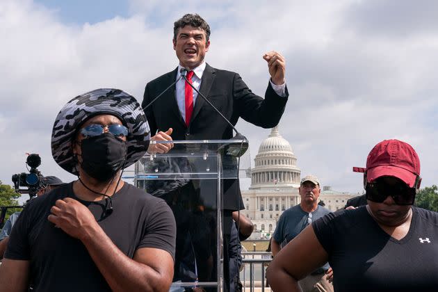 Joe Kent, center, speaks during a rally for Jan. 6 defendants on Sept. 18, 2021. He unseated a more moderate Republican in the 2022 primary, and then narrowly lost the general election.