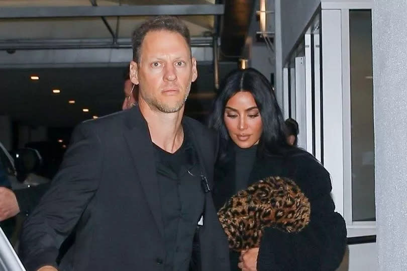 When Kim was spotted leaving the restaurant the night of the album release, she kept her head down and pursed her lips together, keeping her eye line low