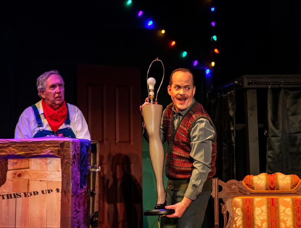 Actor James Flaherty, playing the old man, receives the famed leg lamp from the delivery man, played by Ron Young during the final dress rehearsal for Desert Theatreworks' production of "A Christmas Story" at the Indio Performing Arts Center in Indio, Calif., Thursday, Nov. 30, 2023.