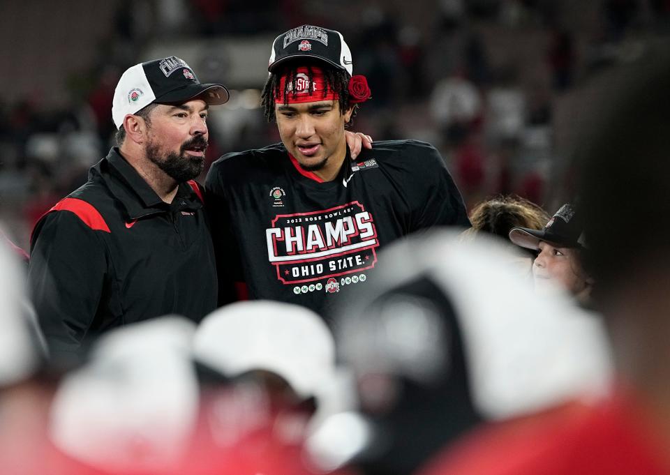 Ohio State Buckeyes quarterback C.J. Stroud (7) gets a hug from head coach Ryan Day following their 48-45 win over the Utah Utes in the Rose Bowl in Pasadena, Calif. on Jan. 1, 2022.