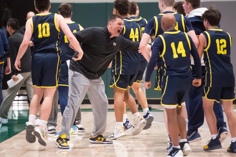 Eastern York head coach Justin Seitz high-fives his players after the Golden Knights held onto a 46-45 win in double overtime against Red Lion during a YAIAA boys' semifinal game at York Tech, Wednesday, Feb. 16, 2022, in York Township.
