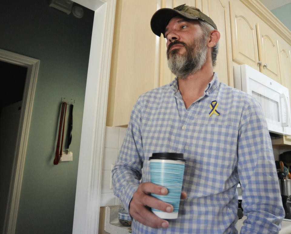 Alex Drueke, ecently released from three months of Russian captivity, pauses during an interview at home in Tuscaloosa, Ala., on Friday, Sept. 30, 2022. Drueke and fellow Alabamian Andy Huynh were captured after traveling to Ukraine to help in the fight against Russian invaders. (AP Photo/Jay Reeves)