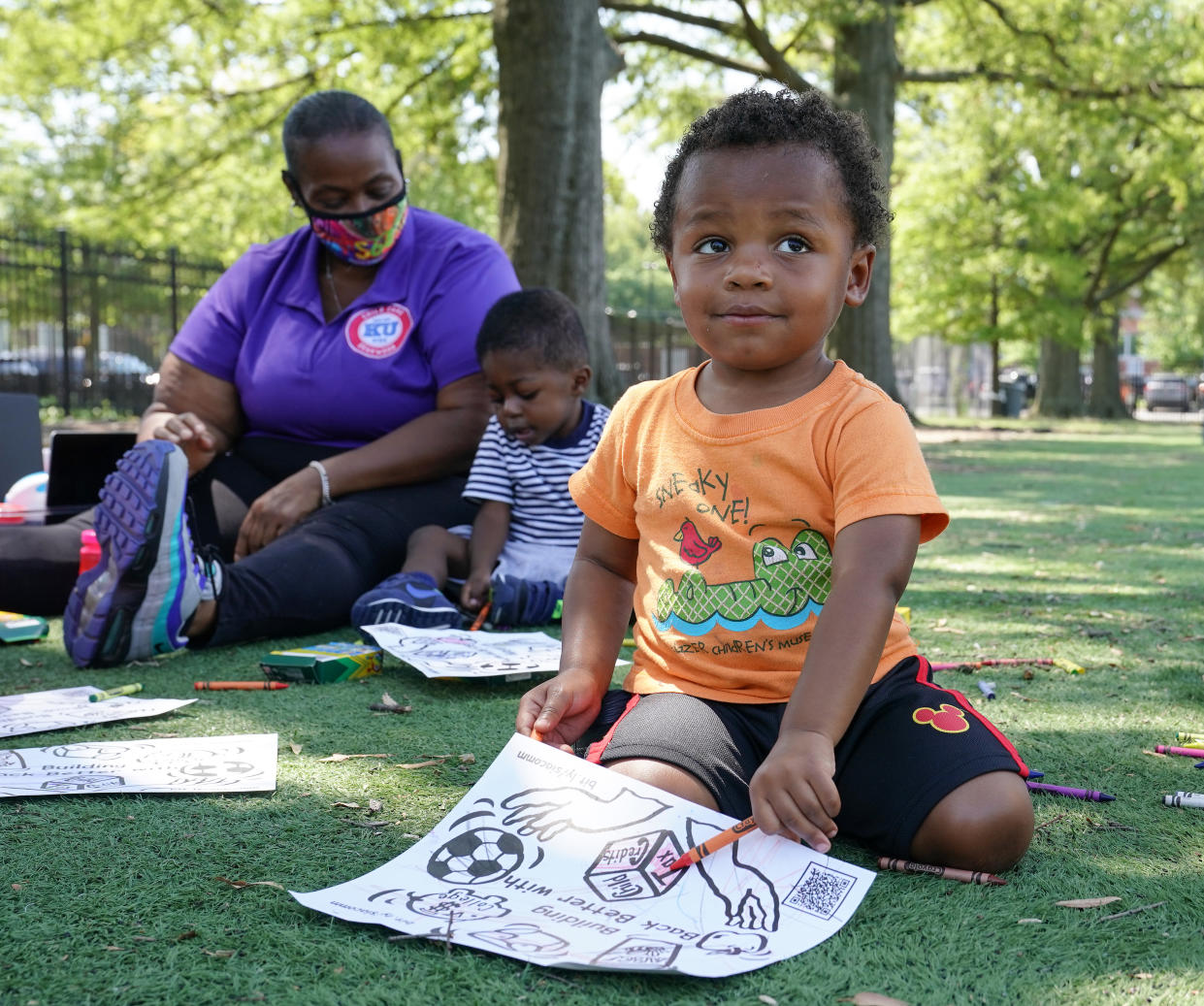 WASHINGTON, DC - JULY 14: Children from the KU Kids Deanwood Childcare Center complete activities at an event celebrating the launch of the Child Tax Credit on July 14, 2021 at the KU Kids Deanwood Childcare Center in Washington, DC. (Photo by Jemal Countess/Getty Images for Community Change)