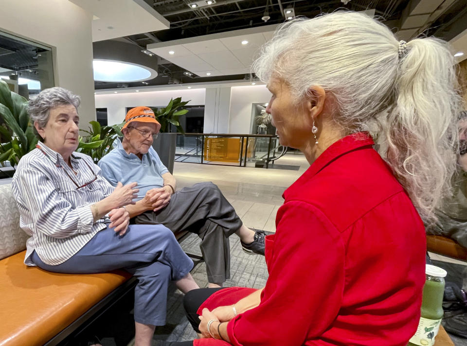 Roz and Nelson Hyman, left, talk with their friend Elizabeth Grove at a shopping complex in Towson, Md., Sept. 18, 2022. The Hymans are Democrats who say President Joe Biden’s age, 80 on Sunday, isn’t a concern for them if he decides to run for another term. The oldest president in U.S. history has a record as a campaign winner and has posted major legislative successes in recent months. But surveys of voters point to concern about his capabilities. (AP Photo/Cal Woodward)