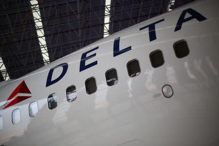 FILE PHOTO: A Delta Airlines aeroplane is seen inside of a hangar during a launch event of the new alliance between AeroMexico and Delta Airlines and their announcement as sponsors of the Mexican soccer team, in Mexico City, Mexico, May 3, 2017. REUTERS/Edgard Garrido