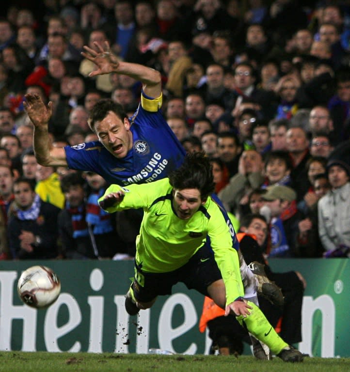 Chelsea's John Terry (L) dives over the ball with Barcelona's Lionel Messi during a Champions League game at Stamford Bridge in London in February 2006