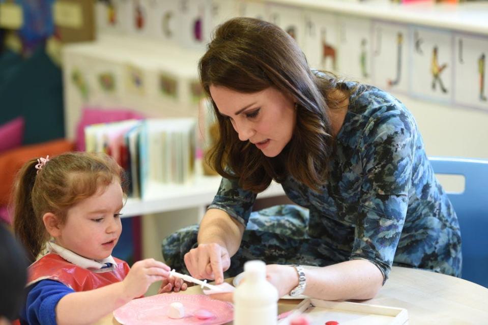 Kate Middleton does an art project with a child