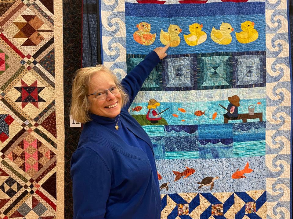 Brenda Young Ferrell displays her row-by-row quilt “H20” at the Town of Farragut Quilt Show held Feb. 19.