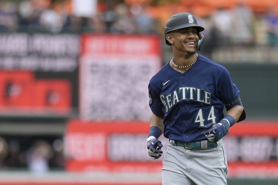 Seattle Mariners' Julio Rodriguez (44) returns to the dugout after flying out to Baltimore Orioles right fielder Anthony Santander during the first inning of a baseball game, Sunday, June 25, 2023, in Baltimore. (AP Photo/Tommy Gilligan)