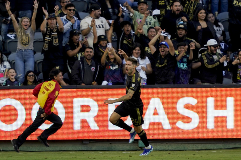 Los Angeles FC midfielder Ryan Hollingshead celebrates after scoring a goal against the Vancouver Whitecaps during the first half of an MLS playoff soccer match Saturday, Oct. 28, 2023, in Los Angeles. (AP Photo/Ryan Sun)