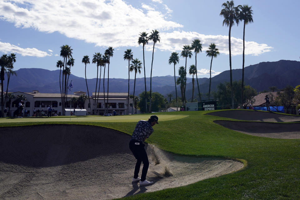 Sam Ryder hits from the bunker to the 18th hole during the second round of the American Express golf tournament at La Quinta Country Club on Friday, Jan. 21, 2022, in La Quinta, Calif. (AP Photo/Marcio Jose Sanchez)